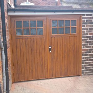 Installed side hinged wooden garage doors