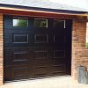 black sectional garage door with square windows