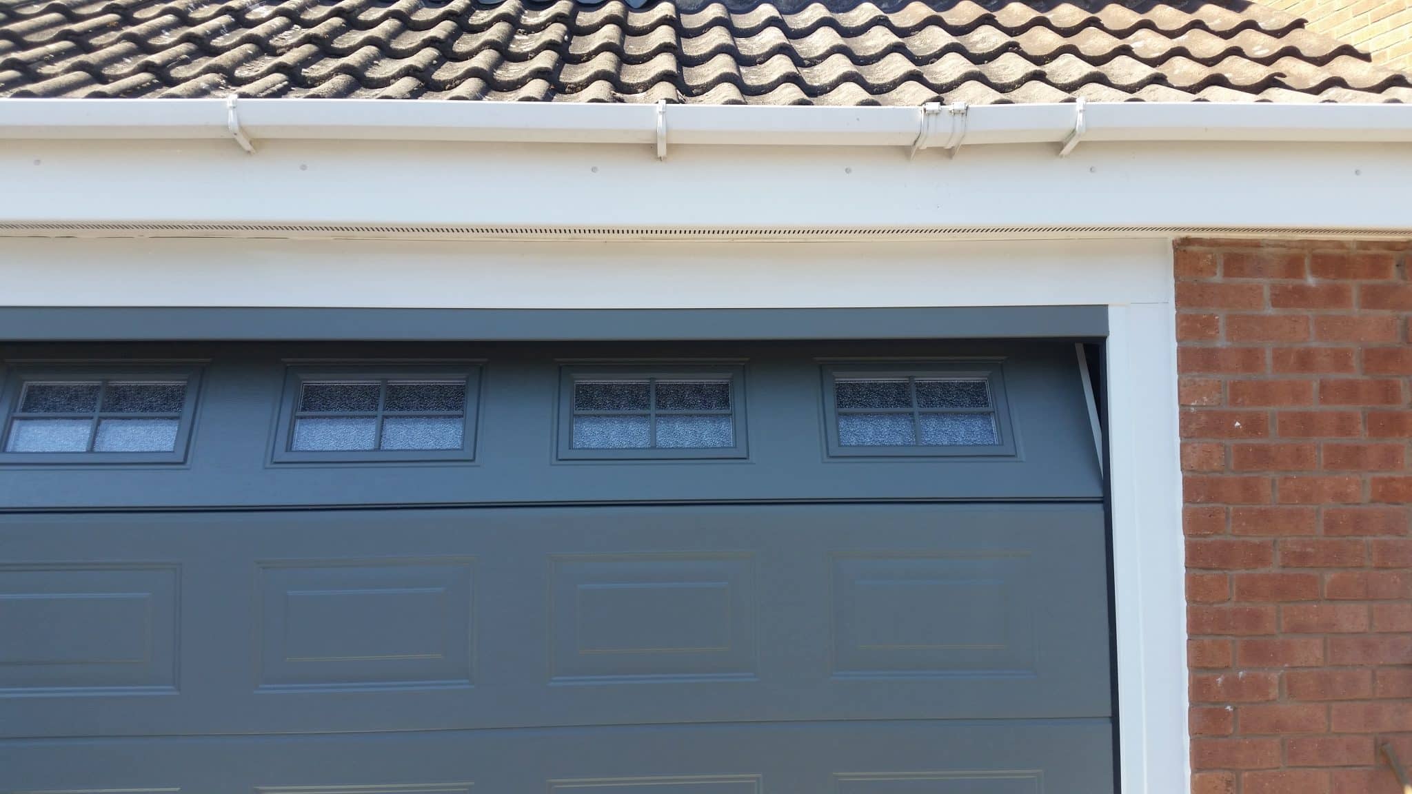 grey novoferm sectional garage door with windows