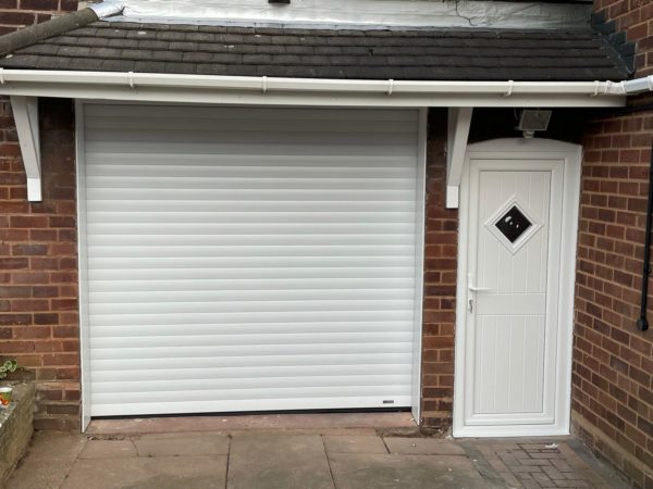 Matching white front door and garage door