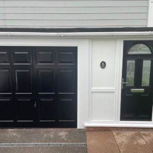 House with matching black front door and garage door