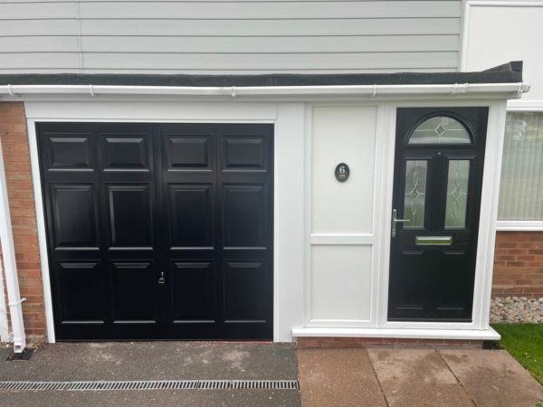 House with matching black front door and garage door