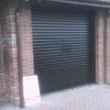 black automatic roller shutter garage door