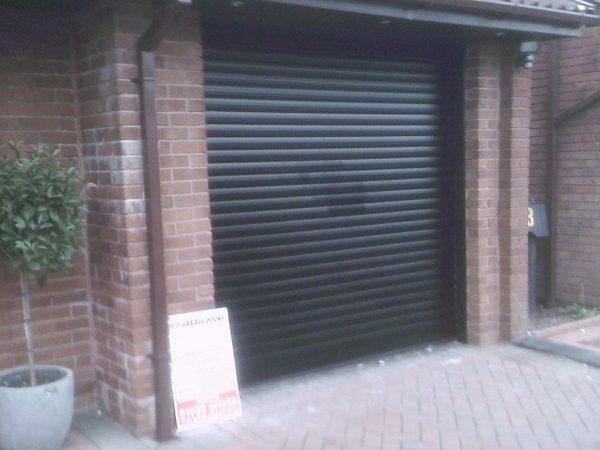 black automatic roller shutter garage door