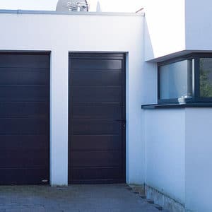 House with matching black garage door and front door