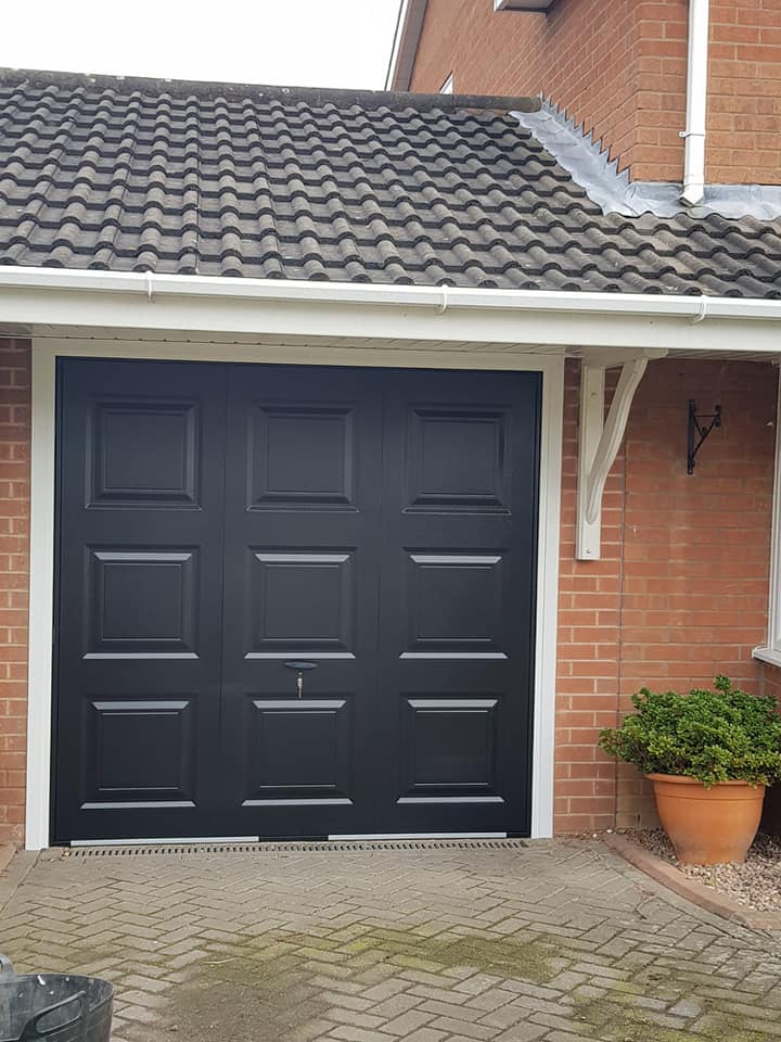 grey up and over canopy style garage door