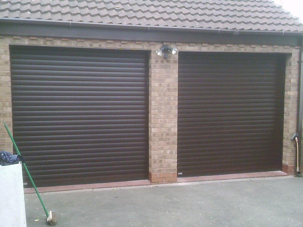 two black roller shutter garage doors