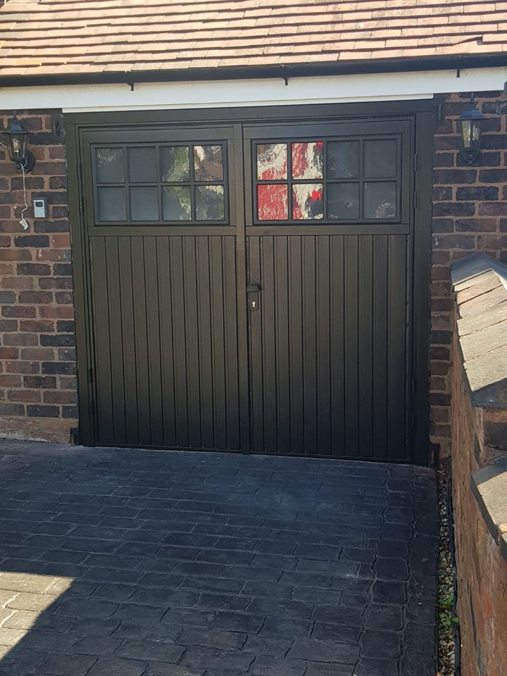 black side hinged garage door installation