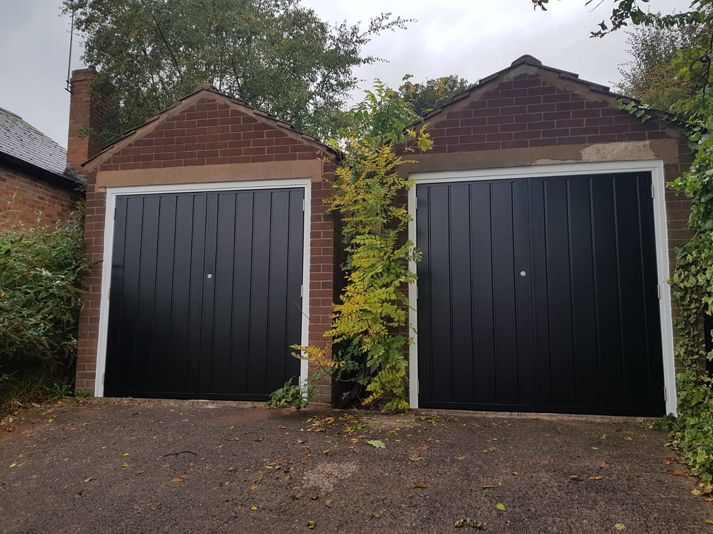 black side hinged garage doors