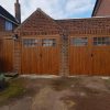 two wooden side hinged garage doors