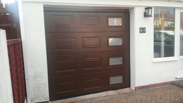 Brown Novoferm Electric Sectional Garage Door with Windows novoferm upvc brown sectional garage door