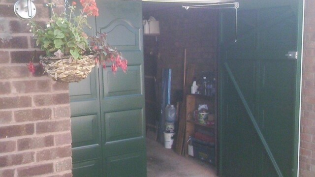 green side hinged garage door