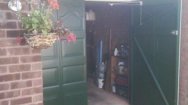 green side hinged garage door