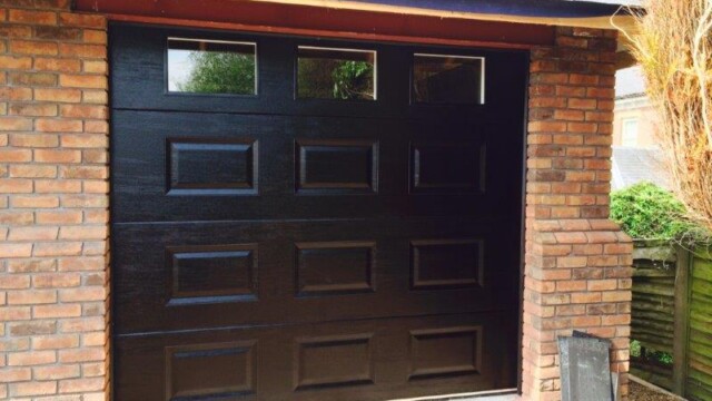 black sectional garage door with square windows