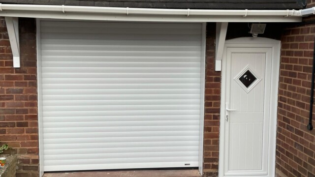 Matching white front door and garage door
