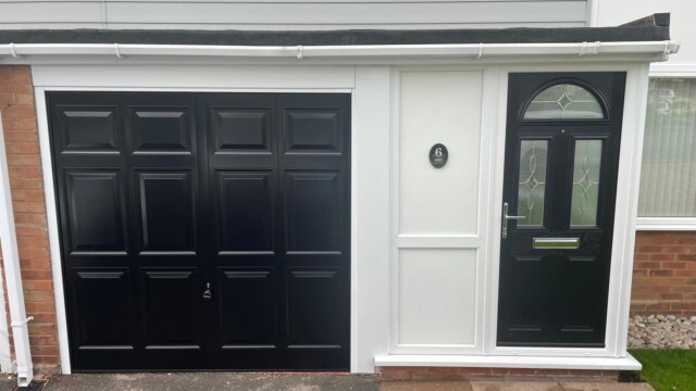 House with matching black front door and garage door