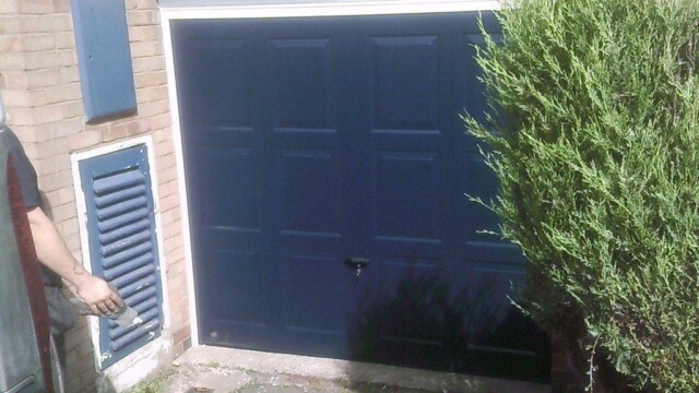 dark blue up and over garage door