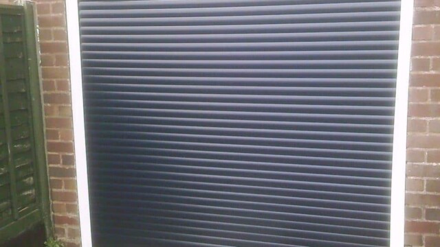 black roller shutter garage door