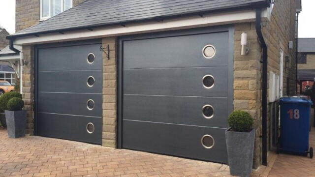 Black Sectional Twin Garage Doors with Windows two black sectional garage doors with windows