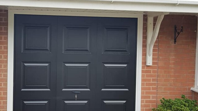 grey up and over canopy style garage door