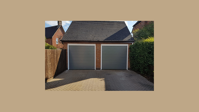 double garage with two grey sectional garage doors