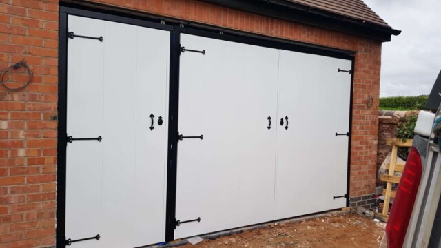White side hinged garage door with pedestrian garage door access