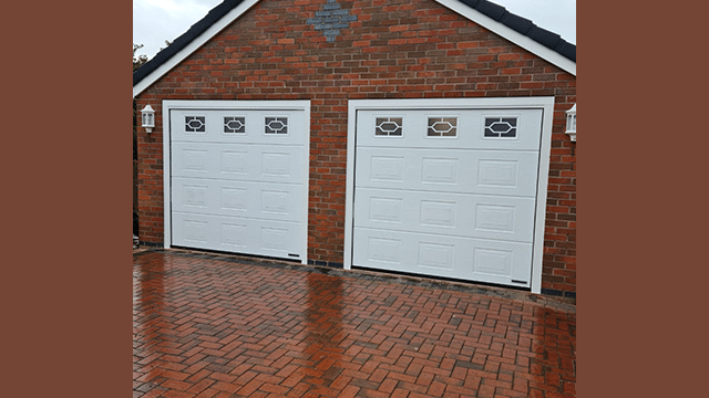 Double garage with white Garolla garage doors