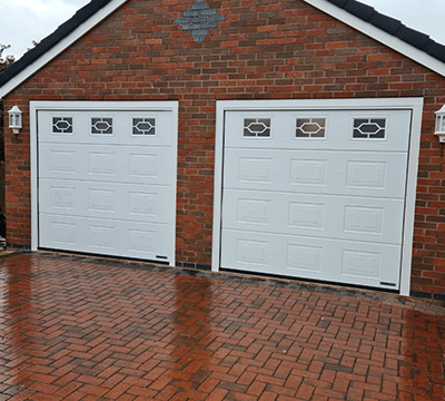 Double garage with white Garolla garage doors