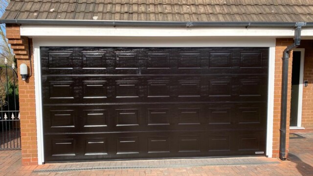 Extra wide black garage door