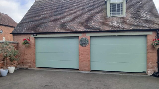 Green Hormann Sectional Twin Garage Doors
