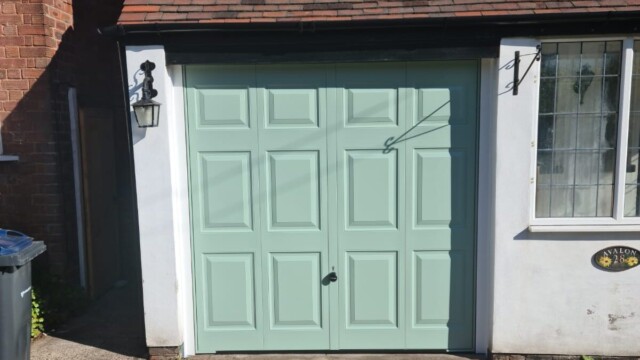 Green Hormann Up and Over Garage Door